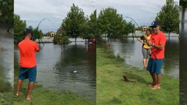 Perth couple land a carp in the park after big rains flood lake