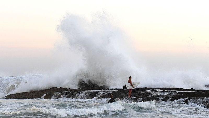 Scorching heat set to return today after day of wild surf